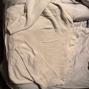 Merino Wool-Blend Ribbed
Turtleneck Sweater